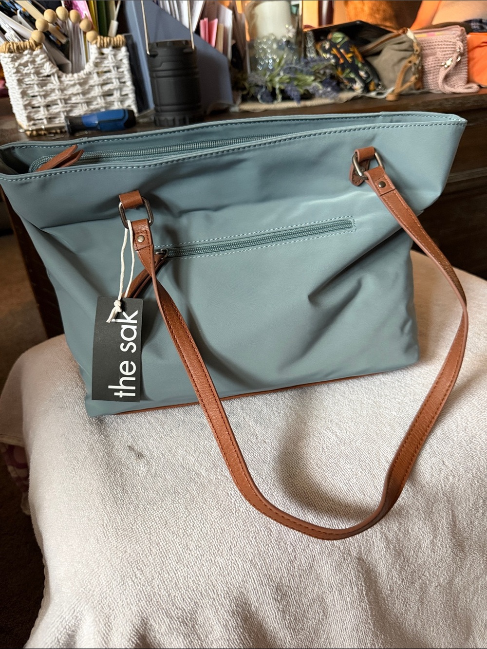 The Sak tote in sage green with brown straps